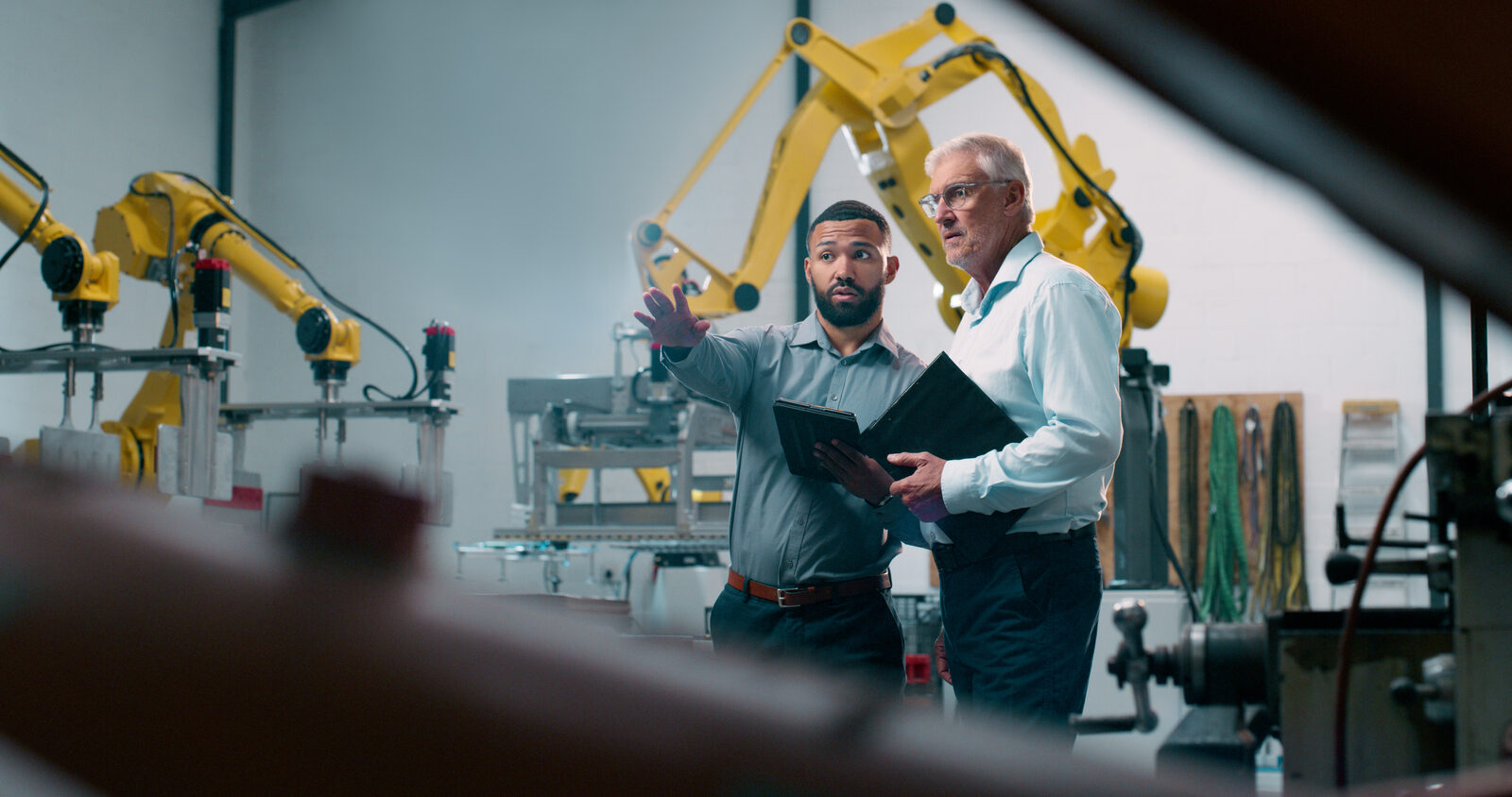 Engineer using a tablet in an industrial setting