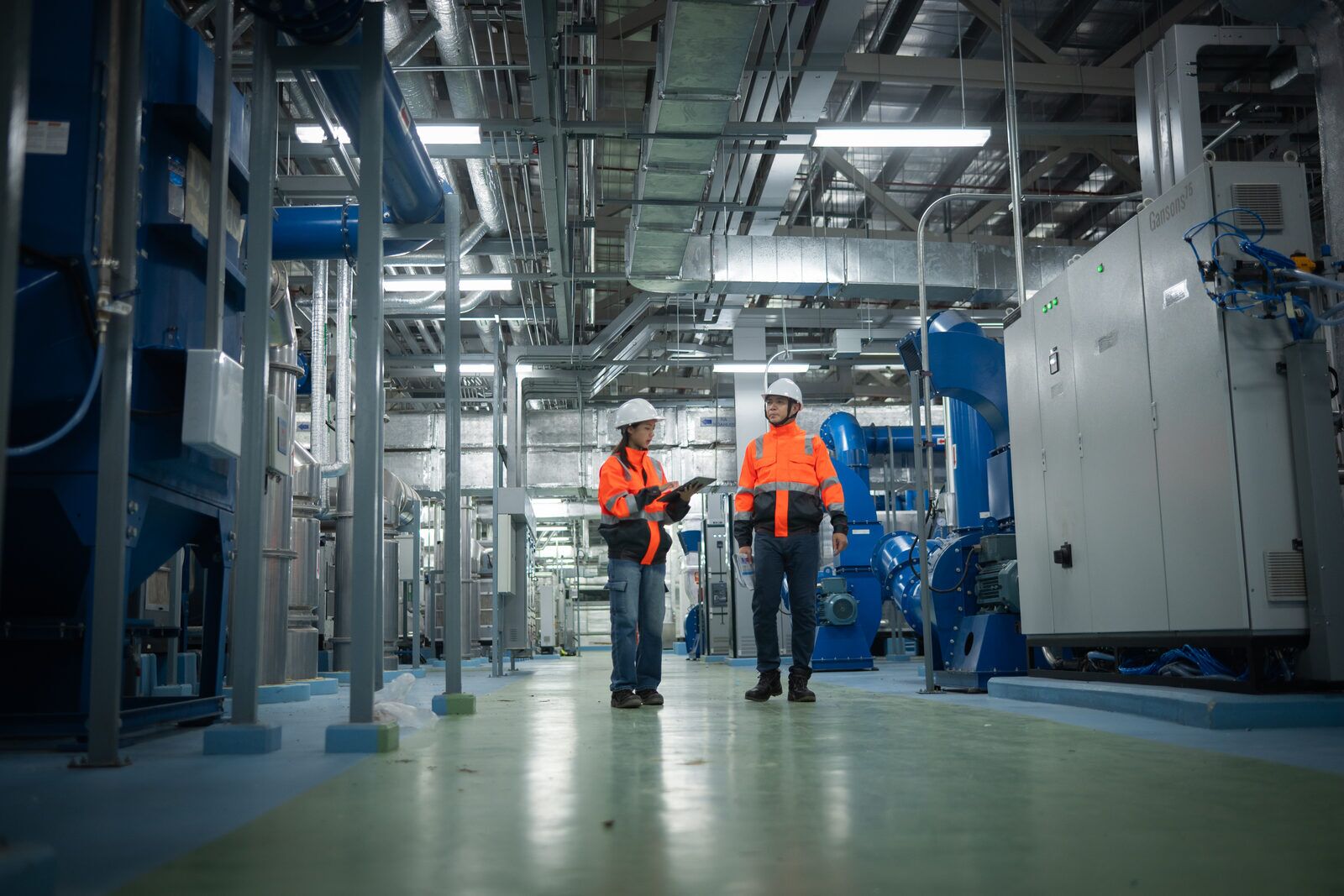 Technician inspecting industrial facility systems